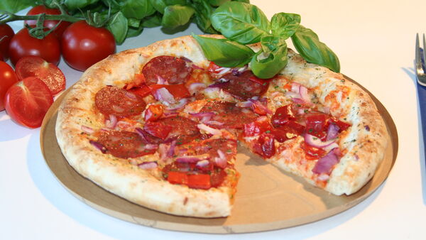 Pizza on a Blechrein baking tray for the food industry Pizza on a Blechrein baking tray for the food industry